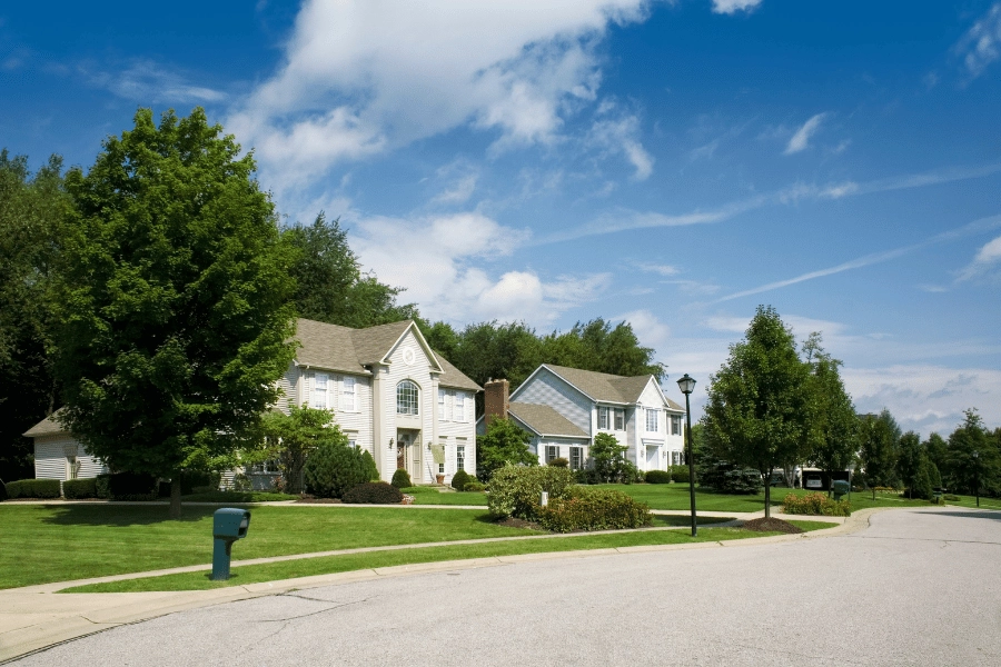 growing suburban neighborhood in Apex, NC with lush greenery and beautiful single-family homes